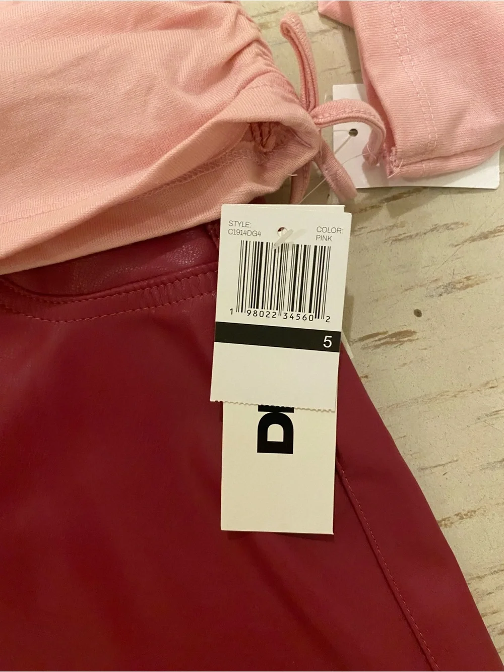 DKNY Pink Long-Sleeve Tee with Leopard Butterfly Print and leather skirt
